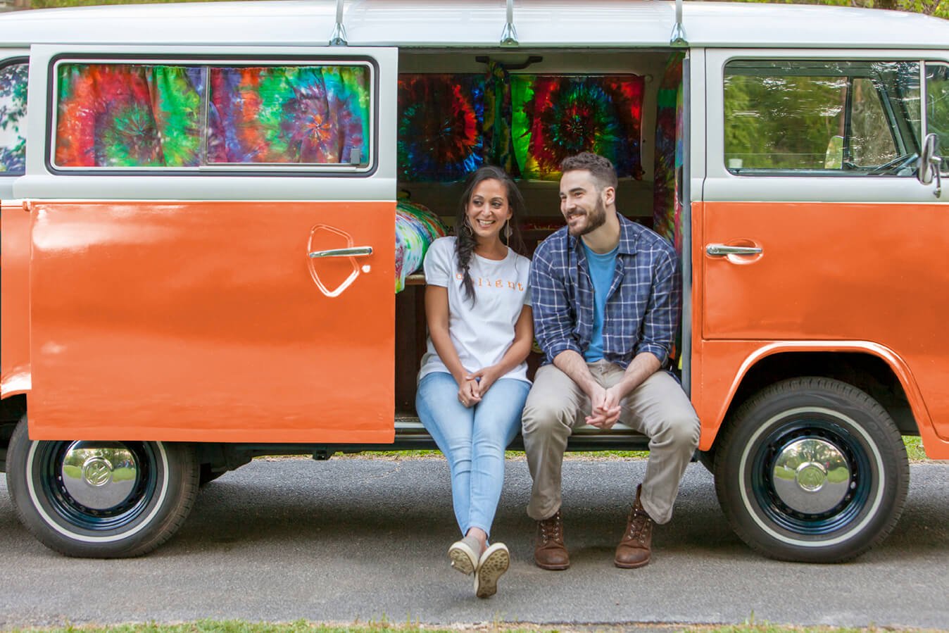 Couple sitting on bus door